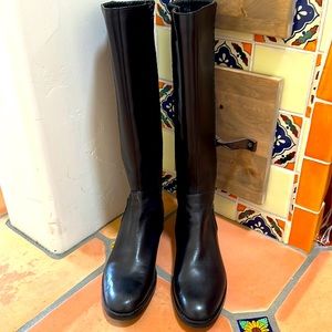 Black leather boots by Cole Haan